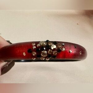 Vintage Alexis Bittar bangle bracelet in red lucite with multi color crystals.
